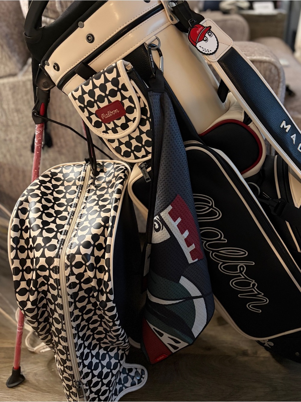 Malbon King of Hearts Stand golf bag w/matching towel.